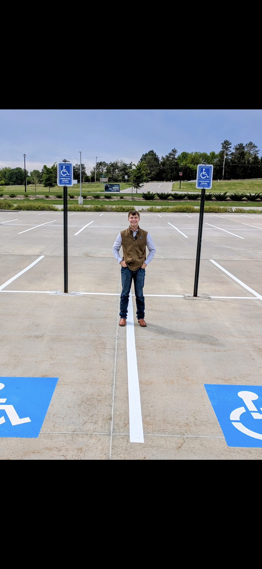 Karter Otte standing in a freshly striped parking lot