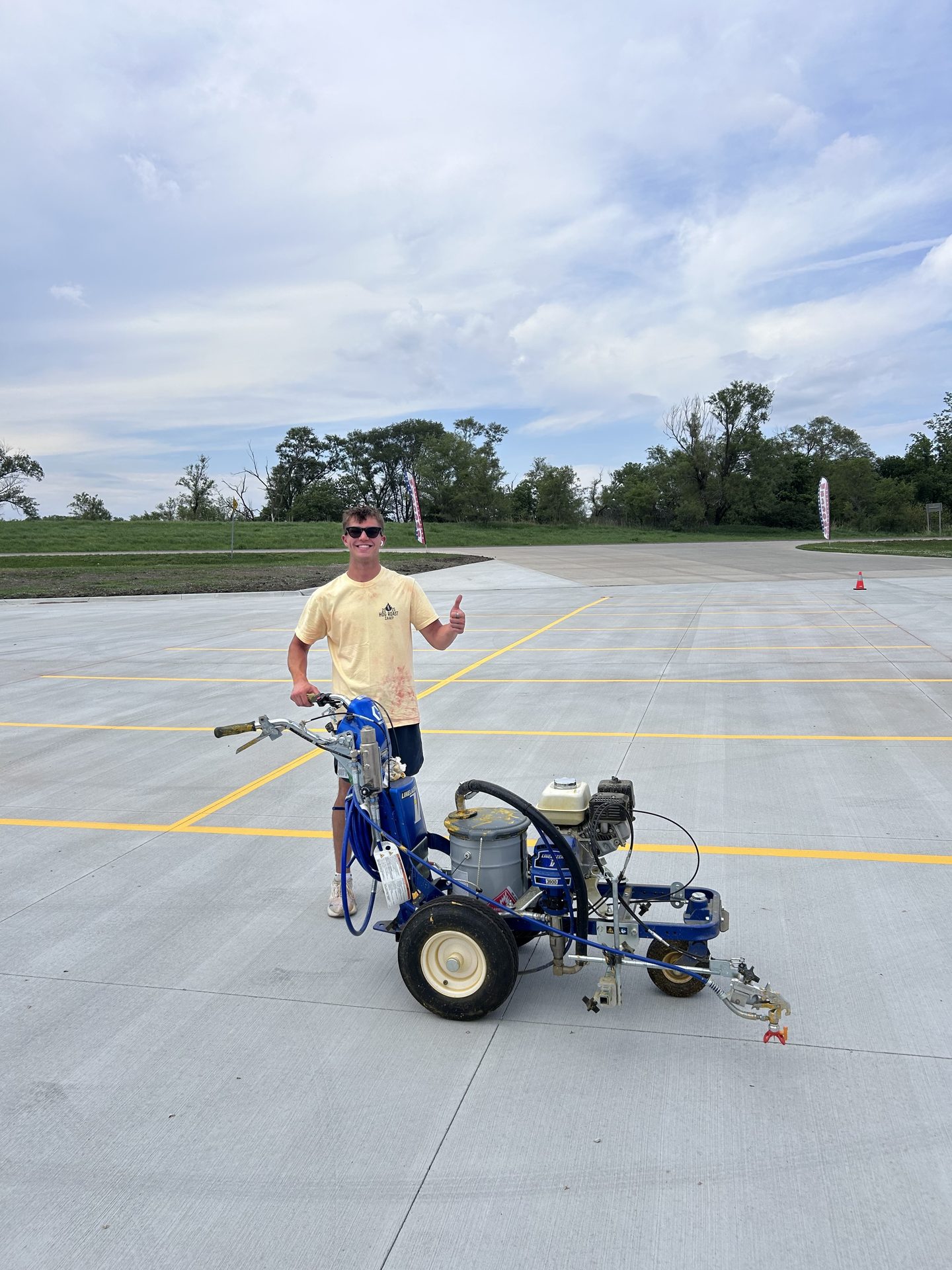 Karter striping a freshly poured lot near Lincoln, NE