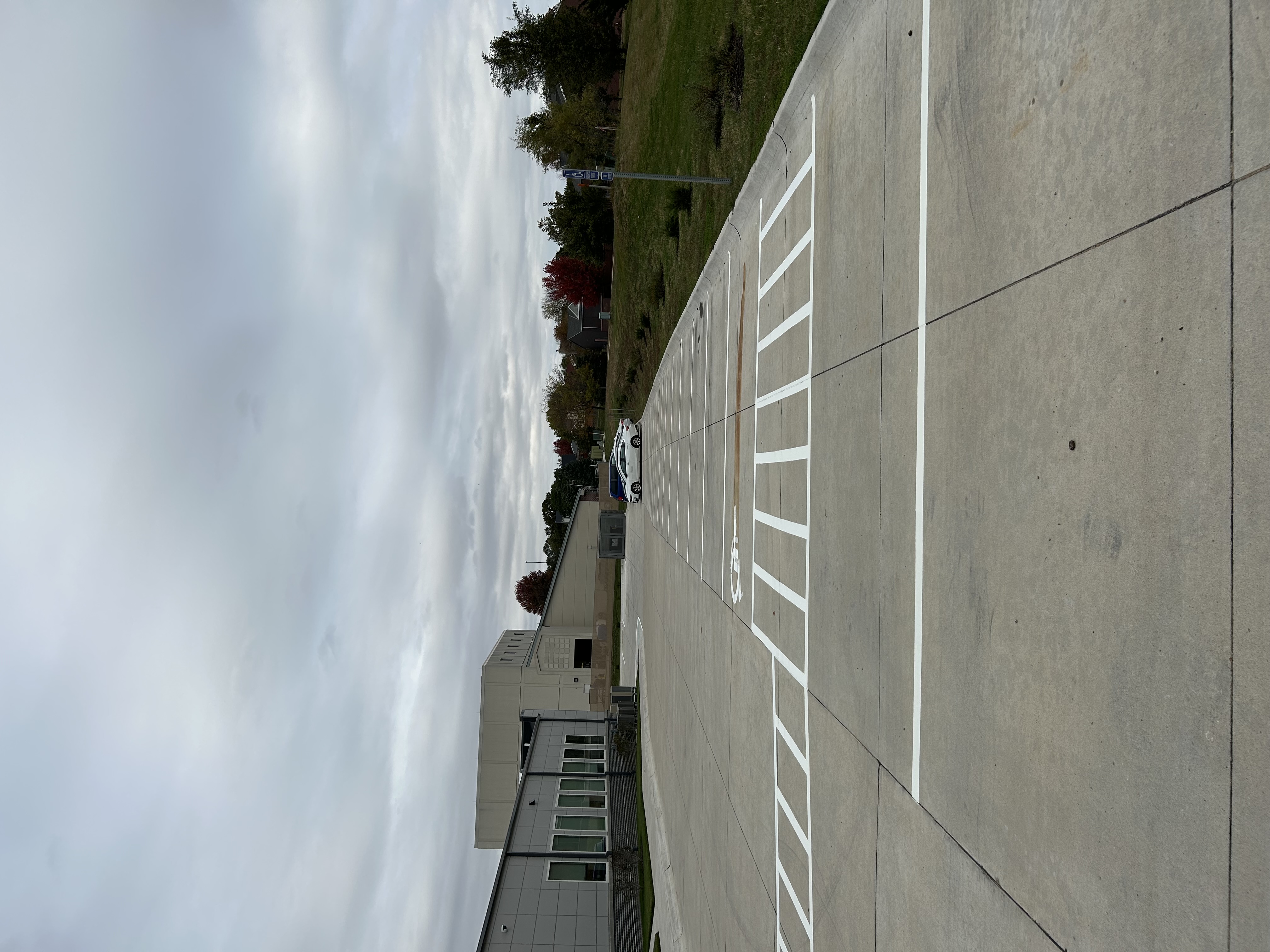 New construction parking lot with white lines and ADA markings