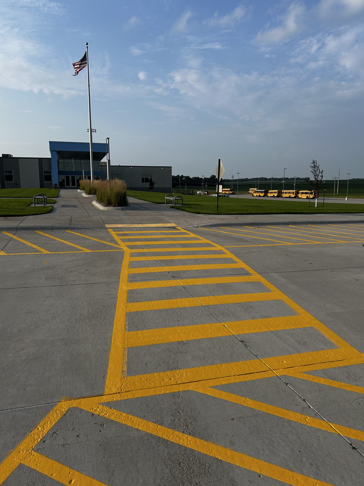 Yellow hatched striping on a newly paved lot